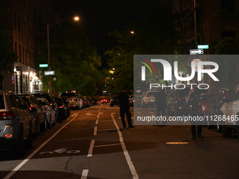 Police tape is blocking the area of the crime scene. Three people are being shot, with two people dead, in a shooting in Bronx, New York, Un...