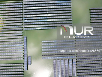 Solar photovoltaic panels are lining up at a photovoltaic power plant in Liuzhou, China, on May 16, 2024. (