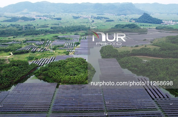 Solar photovoltaic panels are lining up at a photovoltaic power plant in Liuzhou, China, on May 16, 2024. 