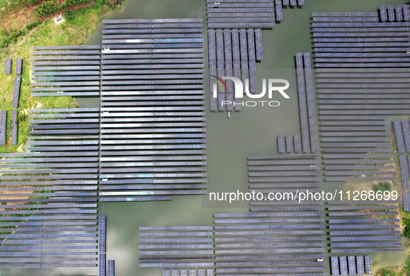 Solar photovoltaic panels are lining up at a photovoltaic power plant in Liuzhou, China, on May 16, 2024. 