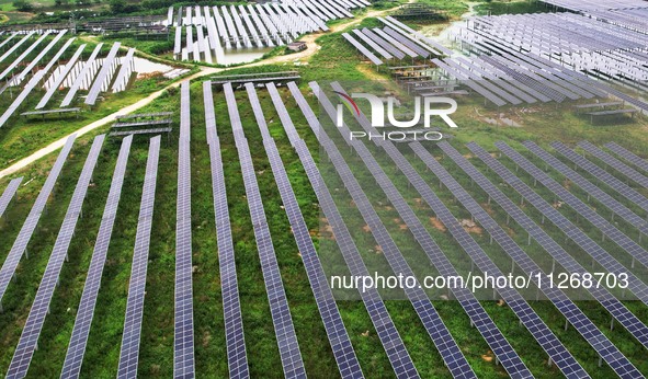 Solar photovoltaic panels are lining up at a photovoltaic power plant in Liuzhou, China, on May 16, 2024. 