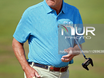 Scott Dunlap of Sarasota, Florida walks on the 5th green during the second round of the KitchenAid Senior PGA Championship at Harbor Shores...