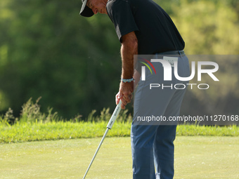Corey Pavin of USA follows his shot on the 17th green during the second round of the KitchenAid Senior PGA Championship at Harbor Shores Res...