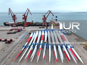 Wind power equipment is being prepared for export at the terminal in Lianyungang, Jiangsu province, in Lianyungang, China, on May 25, 2024....