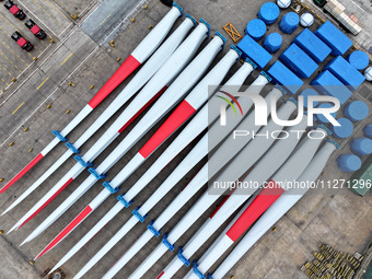 Wind power equipment is being prepared for export at the terminal in Lianyungang, Jiangsu province, in Lianyungang, China, on May 25, 2024....