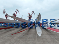 Wind power equipment is being prepared for export at the terminal in Lianyungang, Jiangsu province, in Lianyungang, China, on May 25, 2024....