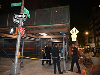 Police officers are investigating the shooting scene. A 27-year-old male is being shot in Manhattan, New York, United States, on May 24, 202...