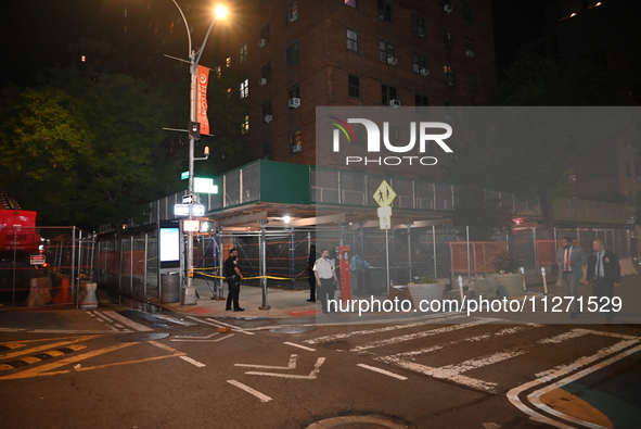 Police officers are investigating the shooting scene. A 27-year-old male is being shot in Manhattan, New York, United States, on May 24, 202...