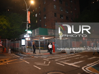 Police officers are investigating the shooting scene. A 27-year-old male is being shot in Manhattan, New York, United States, on May 24, 202...