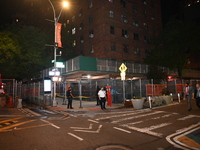 Police officers are investigating the shooting scene. A 27-year-old male is being shot in Manhattan, New York, United States, on May 24, 202...