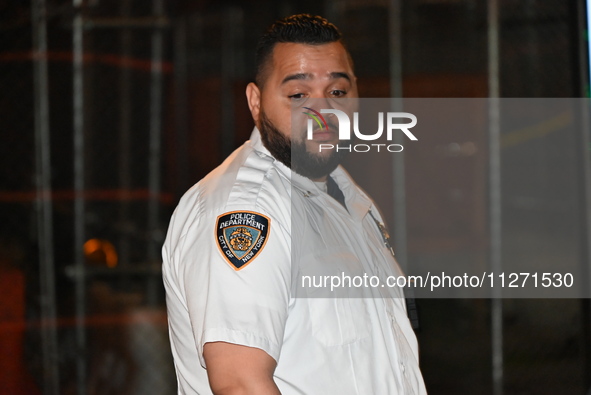 A police officer is investigating the shooting scene. A 27-year-old male is being shot in Manhattan, New York, United States, on May 24, 202...