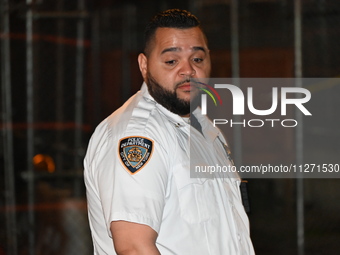 A police officer is investigating the shooting scene. A 27-year-old male is being shot in Manhattan, New York, United States, on May 24, 202...