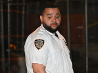 A police officer is investigating the shooting scene. A 27-year-old male is being shot in Manhattan, New York, United States, on May 24, 202...