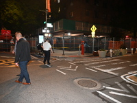 Police officers are investigating the shooting scene. A 27-year-old male is being shot in Manhattan, New York, United States, on May 24, 202...