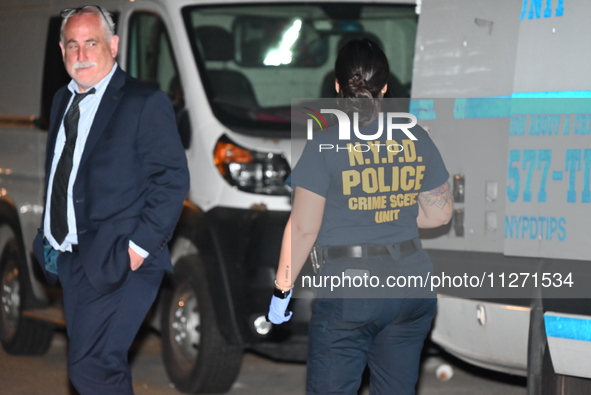 Crime scene investigators from the NYPD Crime Scene Unit are investigating the shooting death of 37-year-old Marcus Henderson, who was shot...