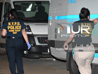 Crime scene investigators from the NYPD Crime Scene Unit are investigating the shooting death of 37-year-old Marcus Henderson, who was shot...