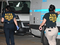 Crime scene investigators from the NYPD Crime Scene Unit are investigating the shooting death of 37-year-old Marcus Henderson, who was shot...