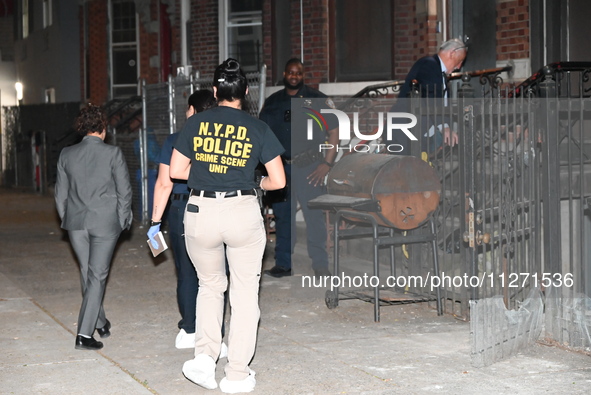 Crime scene investigators from the NYPD Crime Scene Unit are investigating the shooting death of 37-year-old Marcus Henderson, who was shot...