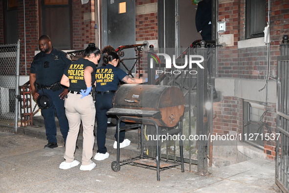 Crime scene investigators from the NYPD Crime Scene Unit are investigating the shooting death of 37-year-old Marcus Henderson, who was shot...