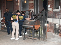 Crime scene investigators from the NYPD Crime Scene Unit are investigating the shooting death of 37-year-old Marcus Henderson, who was shot...