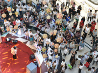 People are watching a performance at a shopping mall in Fuyang, China, on May 25, 2024. The World Health Organization (WHO) is releasing its...