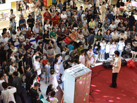 People are watching a performance at a shopping mall in Fuyang, China, on May 25, 2024. The World Health Organization (WHO) is releasing its...