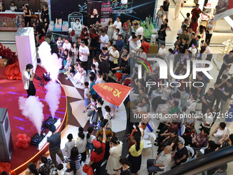 People are watching a performance at a shopping mall in Fuyang, China, on May 25, 2024. The World Health Organization (WHO) is releasing its...