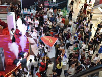 People are watching a performance at a shopping mall in Fuyang, China, on May 25, 2024. The World Health Organization (WHO) is releasing its...