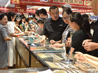 People are shopping for gold jewelry at a mall in Fuyang, China, on May 25, 2024. The World Health Organization (WHO) is releasing its annua...