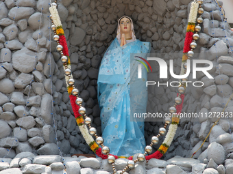 A statue of the Virgin Mary is being dressed in a saree outside Saint Peter's Church in Thiruvananthapuram (Trivandrum), Kerala, India, on A...