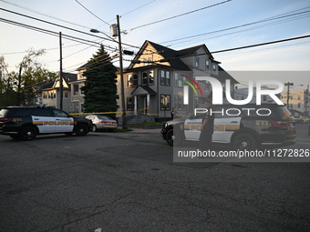 Police officers are blocking the area of the crime scene on Saturday morning. Three people are being shot in Paterson, New Jersey, United St...