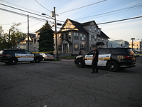 Police officers are blocking the area of the crime scene on Saturday morning. Three people are being shot in Paterson, New Jersey, United St...