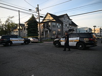 Police officers are blocking the area of the crime scene on Saturday morning. Three people are being shot in Paterson, New Jersey, United St...