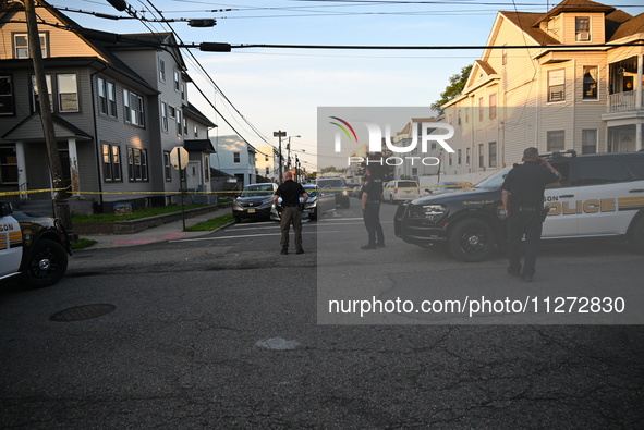 Police officers are blocking the area of the crime scene on Saturday morning. Three people are being shot in Paterson, New Jersey, United St...