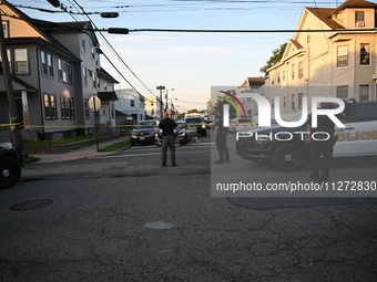 Police officers are blocking the area of the crime scene on Saturday morning. Three people are being shot in Paterson, New Jersey, United St...