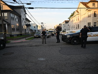 Police officers are blocking the area of the crime scene on Saturday morning. Three people are being shot in Paterson, New Jersey, United St...