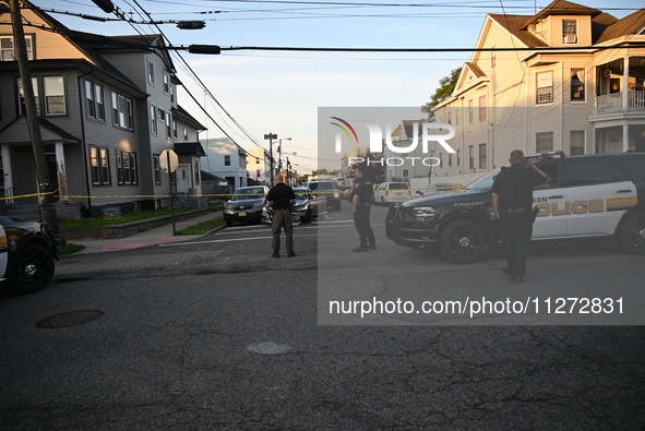 Police officers are blocking the area of the crime scene on Saturday morning. Three people are being shot in Paterson, New Jersey, United St...