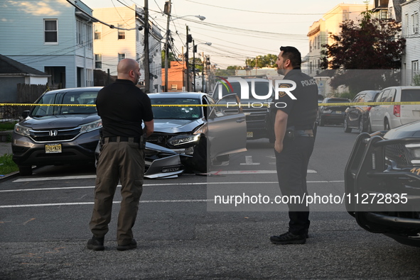 Police officers are blocking the area of the crime scene on Saturday morning. Three people are being shot in Paterson, New Jersey, United St...