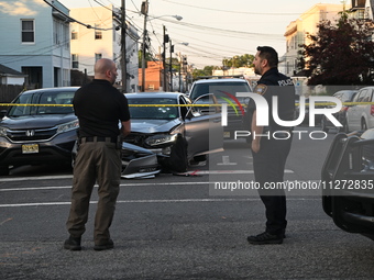 Police officers are blocking the area of the crime scene on Saturday morning. Three people are being shot in Paterson, New Jersey, United St...