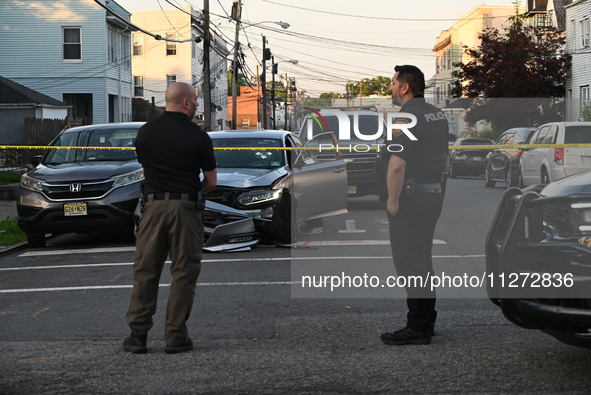 Police officers are blocking the area of the crime scene on Saturday morning. Three people are being shot in Paterson, New Jersey, United St...