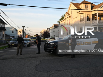 Police officers are blocking the area of the crime scene on Saturday morning. Three people are being shot in Paterson, New Jersey, United St...