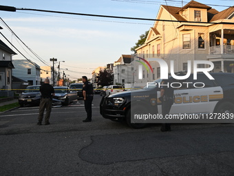 Police officers are blocking the area of the crime scene on Saturday morning. Three people are being shot in Paterson, New Jersey, United St...