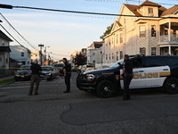 Police officers are blocking the area of the crime scene on Saturday morning. Three people are being shot in Paterson, New Jersey, United St...