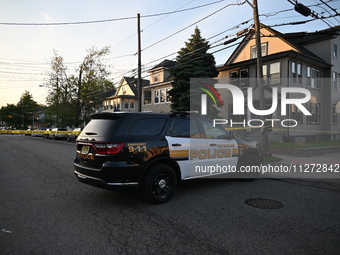 Police officers are blocking the area of the crime scene on Saturday morning. Three people are being shot in Paterson, New Jersey, United St...