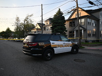 Police officers are blocking the area of the crime scene on Saturday morning. Three people are being shot in Paterson, New Jersey, United St...