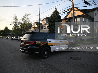 Police officers are blocking the area of the crime scene on Saturday morning. Three people are being shot in Paterson, New Jersey, United St...