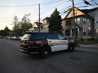 Police officers are blocking the area of the crime scene on Saturday morning. Three people are being shot in Paterson, New Jersey, United St...