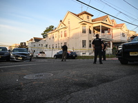 Police officers are blocking the area of the crime scene on Saturday morning. Three people are being shot in Paterson, New Jersey, United St...