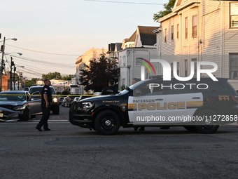 Police officers are blocking the area of the crime scene on Saturday morning. Three people are being shot in Paterson, New Jersey, United St...