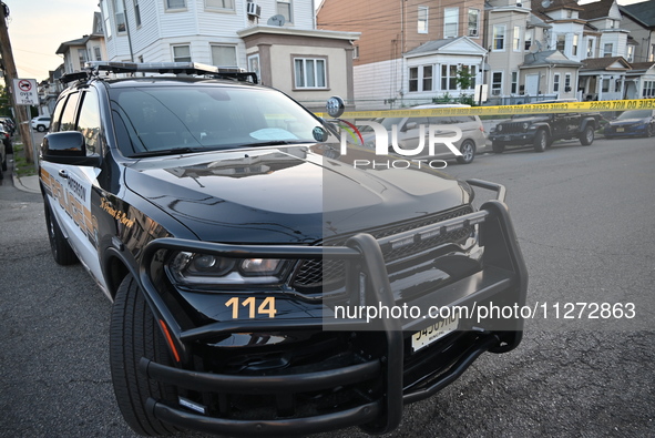 Police officers are blocking the area of the crime scene on Saturday morning. Three people are being shot in Paterson, New Jersey, United St...